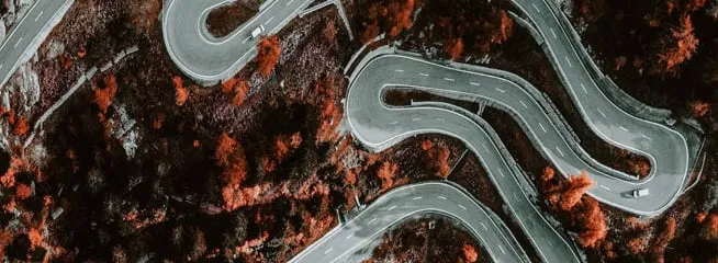 birds eye view of a road passing through nature